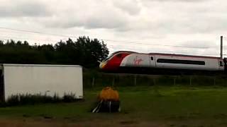 preview picture of video 'Newton le Willows 16.6.2013 - Various Virgin trains passing on the WCML'