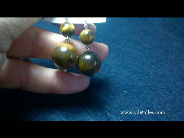 Vídeo relacionado con Pendientes plata de ley 925 con concha natural - Conocida como Ojo de Santa Lucía u Ojo de shiva - Pendientes de botón con diámetro de 8 milímetros - Aptos para pieles sensibles