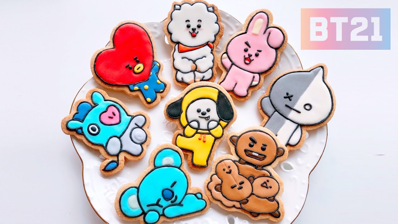 A row of BT21 character cookies including Cooky Shooky Tata RJ Koya Mang Chimmy and Van decorated to match each character's design and color