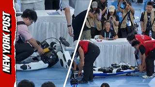 Moment Robot Slams Into Judges’ Table At China World Humanoid Robot Games