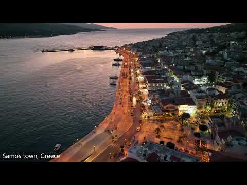 Drone flight over Samos town, Greece at dusk