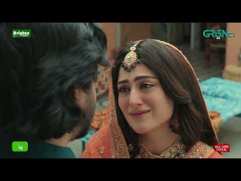 Sundri sits by a traditional wooden window, gazing out at the rain-washed garden with a contemplative and heavy expression.