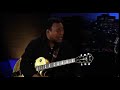 George Benson playing along the neck