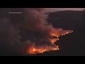 Helicopters battle flames as Palisades Fire burns on Santa Monica Mountains.mp4