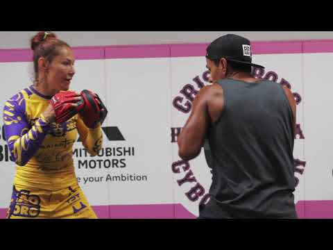 12. Cris Cyborg and Coach Juan Serrano share combinations on the pads for boxing training