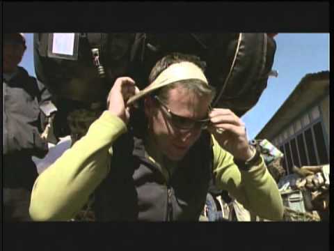 Brent Bishop is changing "backpack" with a Sherpa boy