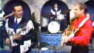 Buck Owens and the Buckeroos - I&#39;ve Got A Tiger By The Tail.