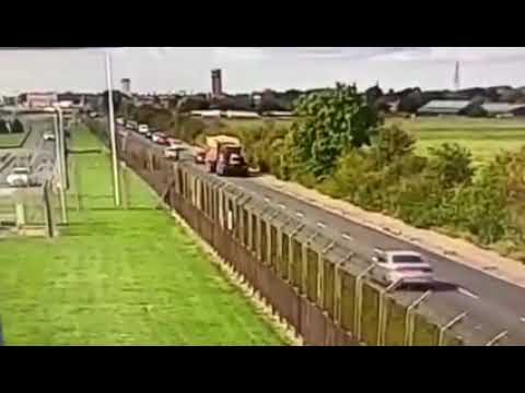 Tractor Flattens Car - Amazingly both drivers escaped serious injury..