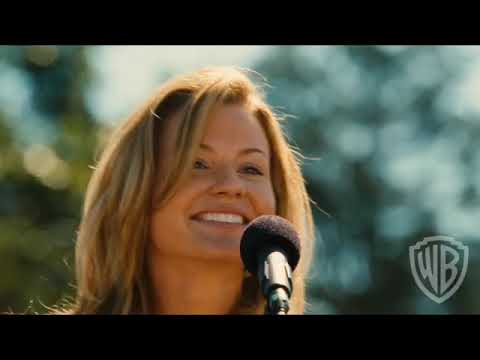 Trailer end card with Pure Country 2 The Gift title over sunlit fairground lights