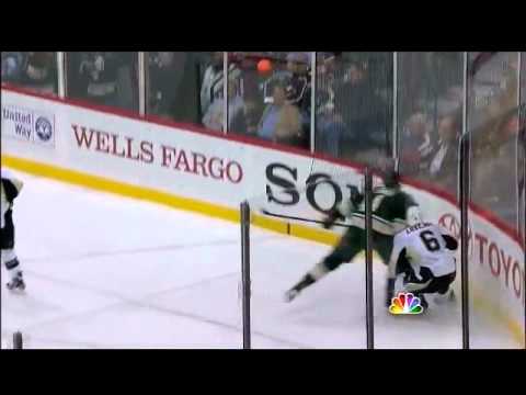 Clayton Stoner hammers Ben Lovejoy into the boards