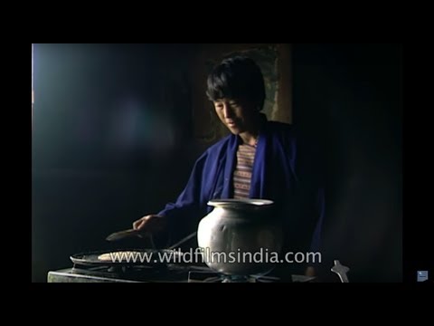 Bhutanese Lady making Bumthap's Kepta (Roti) and Suja (Buttertea)