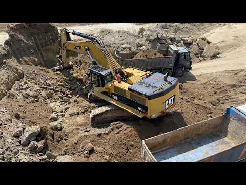 Caterpillar 385C Excavator Loading Trucks