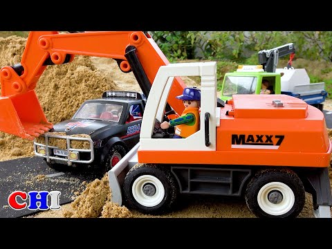 Review of construction toy vehicles: excavator, fire truck, helicopter.