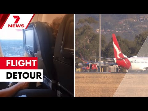 Qantas flight forced to divert mid-flight to Adelaide military base | 7NEWS
