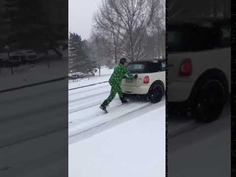 Weed suit lawyer pushes Mini Cooper up a hill