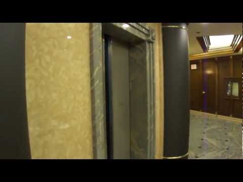 Old Otis Lexan Scenic Traction Elevators at 214 King Street West in Toronto