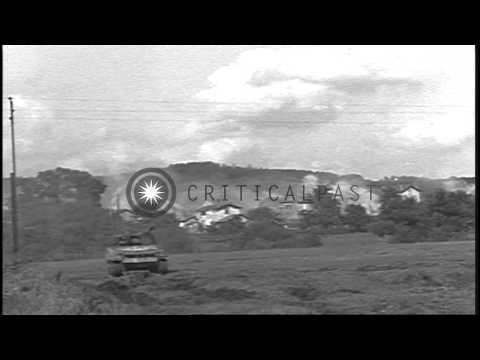 Machine guns mounted on tanks are fired and tanks advance on a field in Nancy, Fr...HD Stock Footage