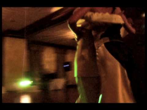  Adrian Costa  and  Amanda Costa  are  dancing  to  the  tango  "  Color Cielo  "