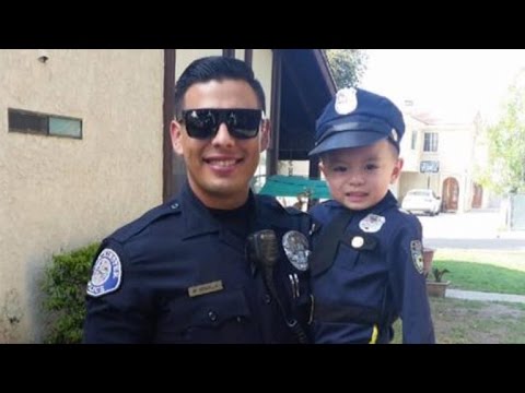 Women Swoon Over 'Hot Cop' After He Posed with 3-Year-Old Wearing Uniform