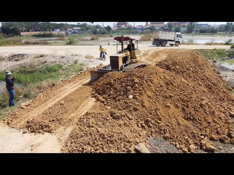 Skillful Land Filling Process — Dump Trucks and KOMATSU Bulldozer Working Smoothly