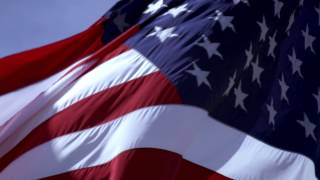 Shot of American flag close up and blowing in the wind.