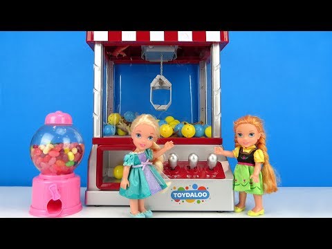 Claw Machine ! Elsa and Anna toddlers win prizes - Arcade game room