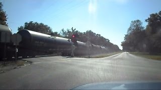 preview picture of video 'CSX Tank Train Chasing Down The Street'