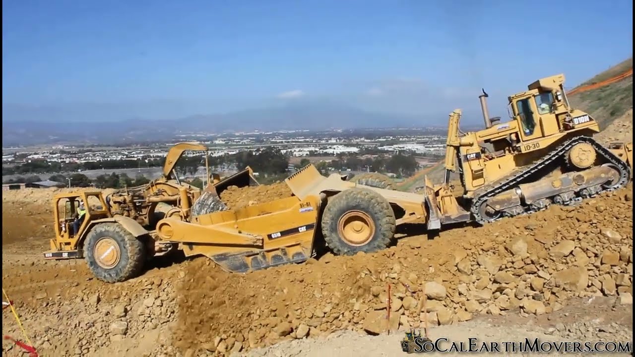 CAT 651B Scrapers working new hilltop cut