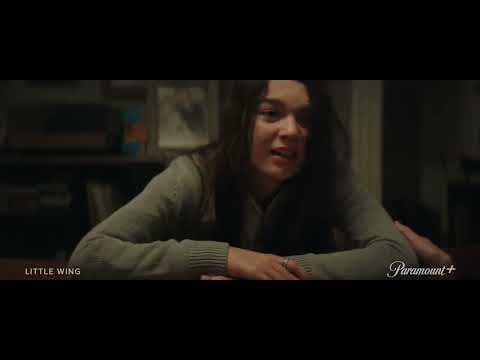 Trailer frame: Kaitlyn on a rooftop, wind in her hair, while a soft piano figure builds