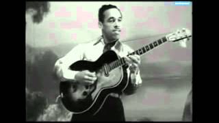 Nat King Cole performs &quot;By the River St. Marie&quot; in the 1944 SWING IN THE SADDLE