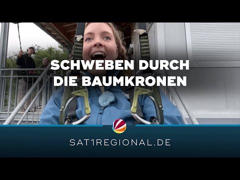 SAT.1 REGIONAL-Reporterin testet Baumschwebebahn in Bad Harzburg