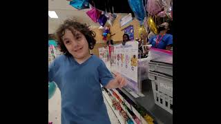 Emmett fills a balloon at party city!