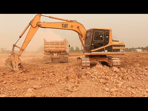Reclamation Of An Old Quarry with Caterpillar  Equipment - Interkat SA-4k