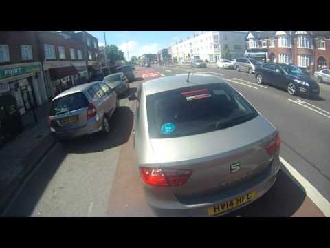 HV14HFC - MGIF Of The Cyclist To Stop In The Bus Lane