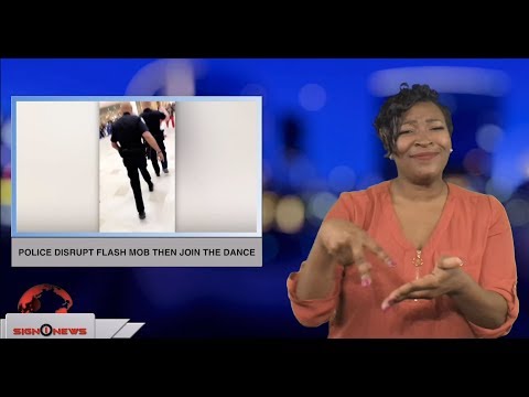 Police disrupt flash mob then join the dance (ASL - 12.22.18)