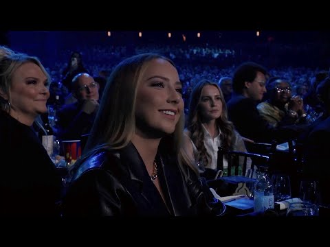 Eminem warns Hailie to plug her ears while he talks about drugs.