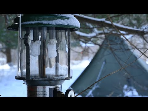 Winter camping. Snow and wind. Two survival items: Coleman Gasoline Lantern 220K, Coleman Stove 502
