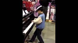 When This Kid Touches A Piano People Tend To Stop And Stare. Very Cool!