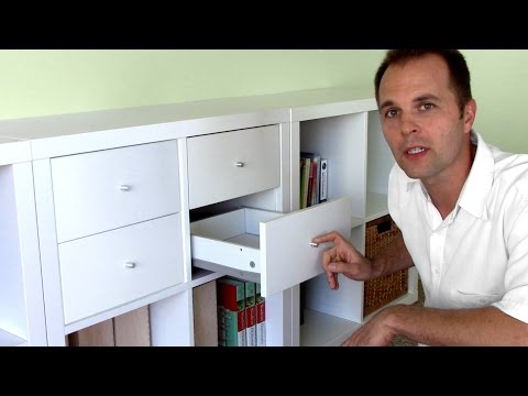 Part of a video titled How to assemble Ikea bookshelf drawers - EXPEDIT KALLAX shelf