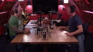 Joe Rogan Smiling at Angry Jim Breuer.