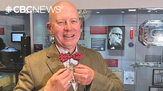 Bow tie lover John Northcott tries on Joey Smallwood’s famous fashion accessory