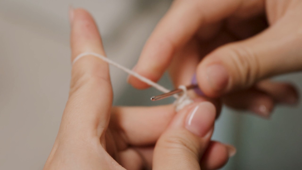 Cam crocheting a Child-You by hand
