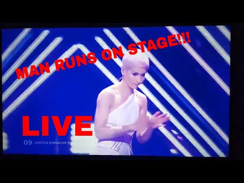 Man grabs microphone during live Great Britain Eurovision performance and gets tackled!!! (LIVE)