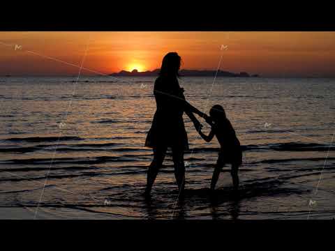 Mother and daughter holding hands and dance on Sunset Sea Beach