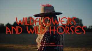 Musik-Video-Miniaturansicht zu Wildflowers and Wild Horses Songtext von Lainey Wilson