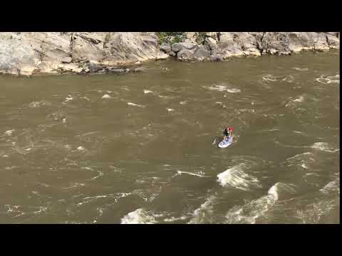 Paddle boarding is popular both on the lake and on the river, this guy is pushing it hard but many adventure seekers do come here for this very exciting challenge