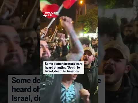 Crowds set fire to U.S. and Israeli flags in Tehran