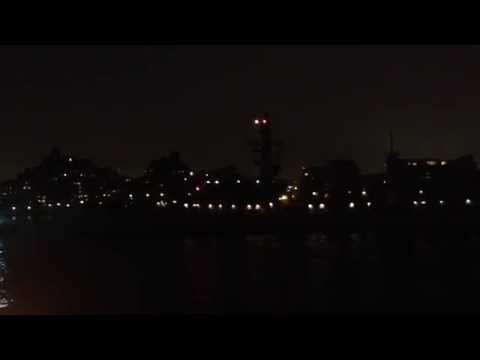 Royal Navy Frigate HMS St Albans (F83) being towed by at night on the Thames