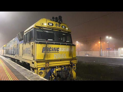 A freight train in heavy fog
