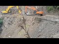 Doosan And Hyundai Excavators Breaking Hill Stone In The Rain